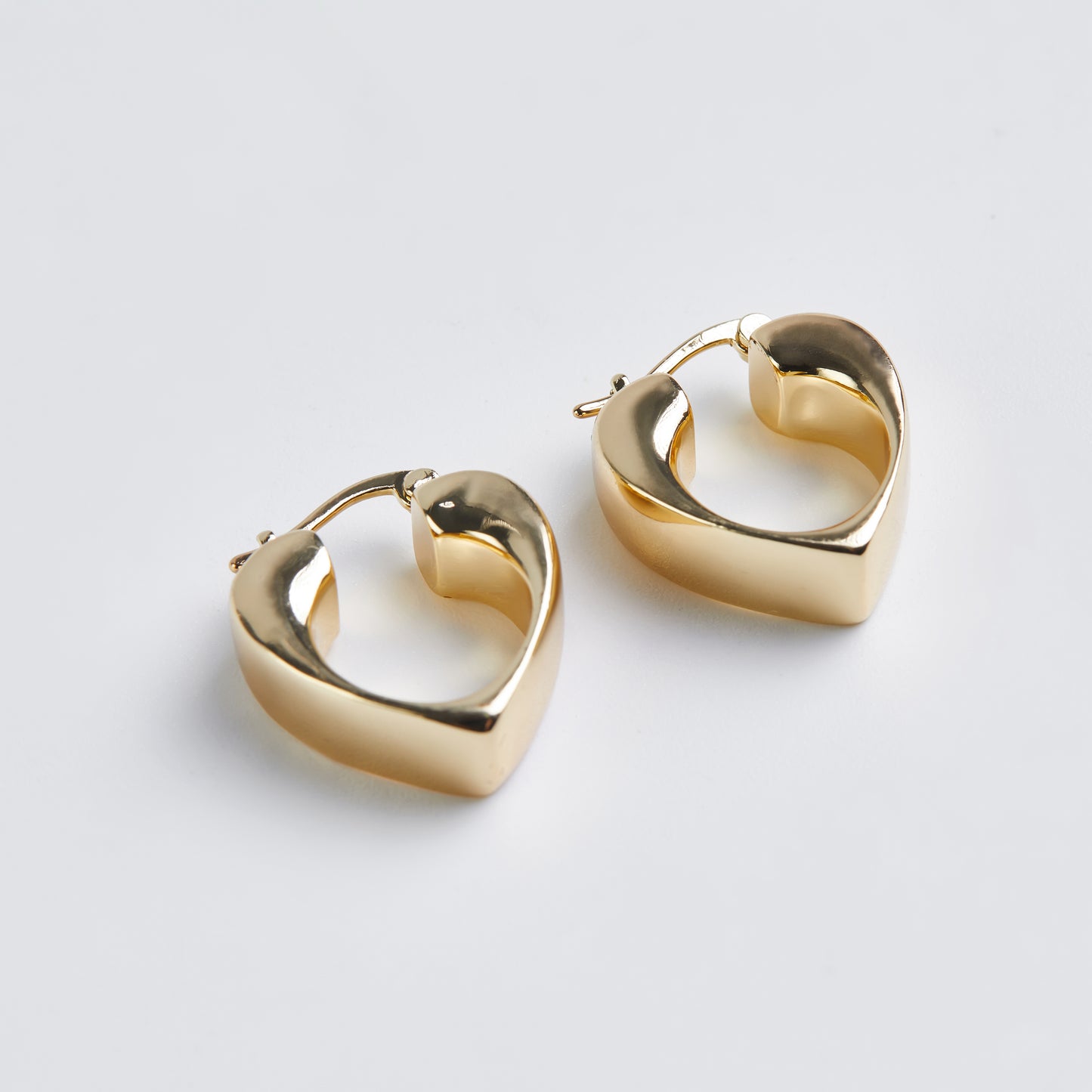 Gilded heartbeat earrings